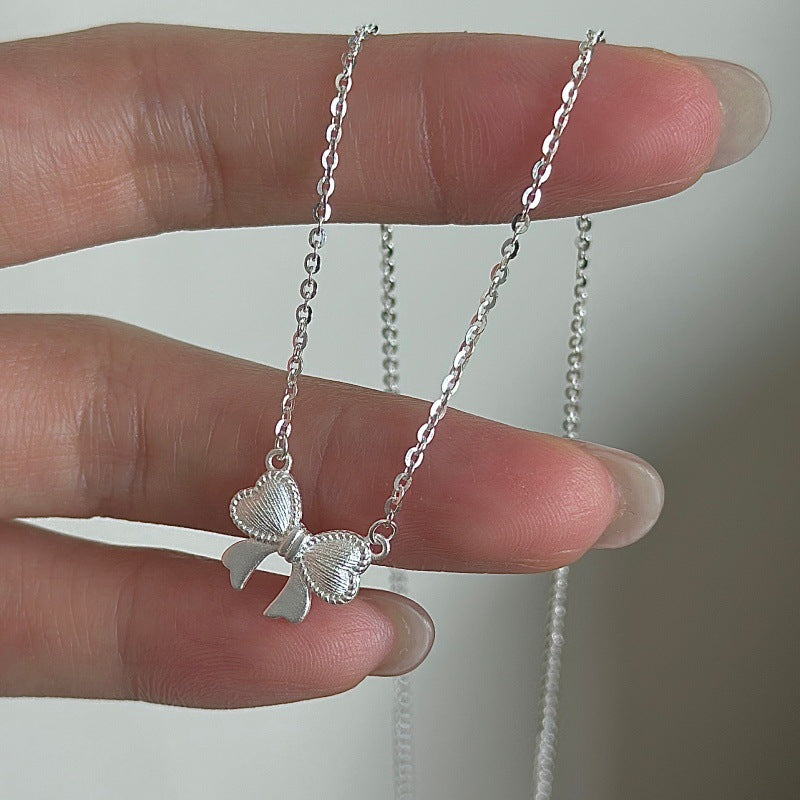 Ribbon Belle S925 Silver Textured Bow Charm Necklace