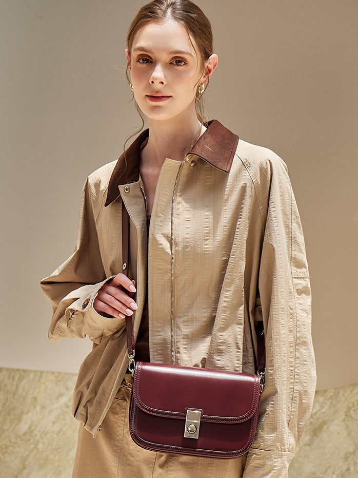 Women's Plain Cowhide Curved Satchel with Twist-Lock Closure