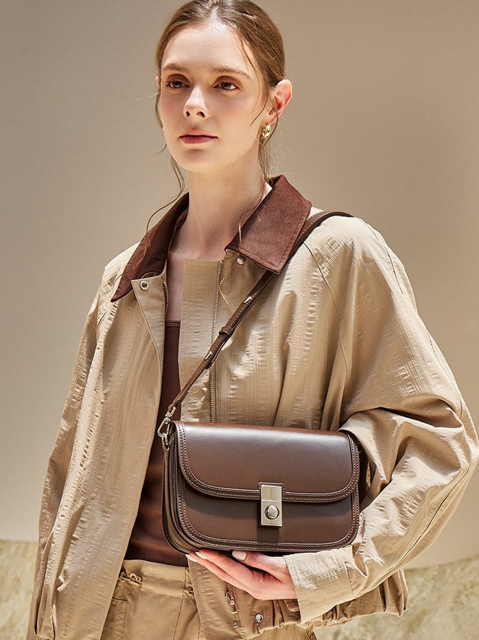 Women's Plain Cowhide Curved Satchel with Twist-Lock Closure