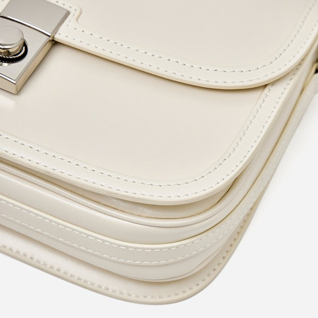 Women's Plain Cowhide Curved Satchel with Twist-Lock Closure