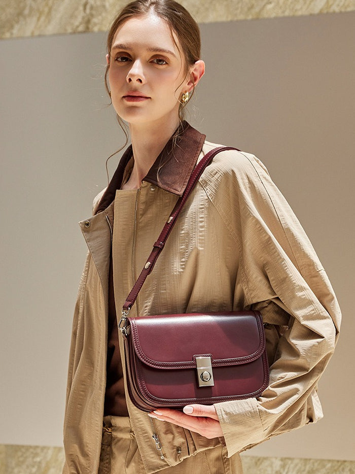 Women's Plain Cowhide Curved Satchel with Twist-Lock Closure