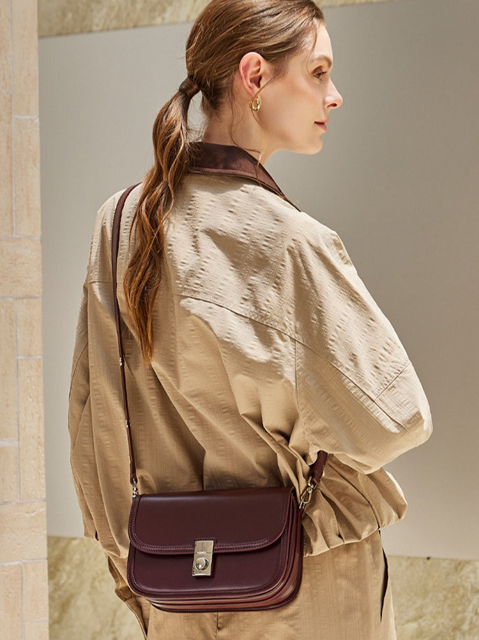 Women's Plain Cowhide Curved Satchel with Twist-Lock Closure