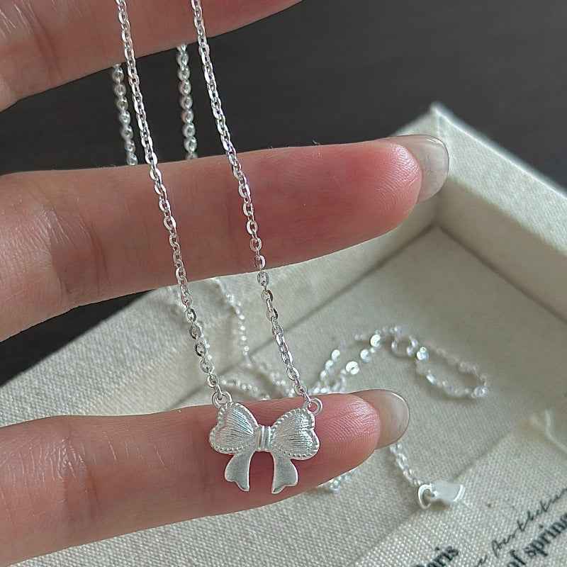 Ribbon Belle S925 Silver Textured Bow Charm Necklace