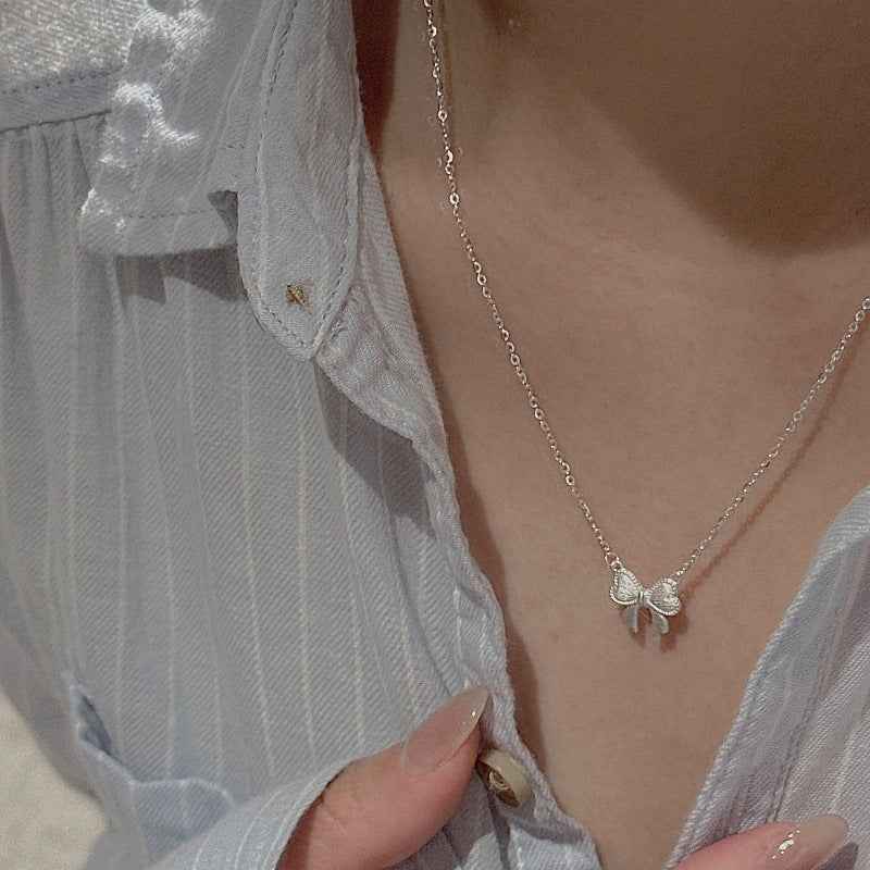 Ribbon Belle S925 Silver Textured Bow Charm Necklace