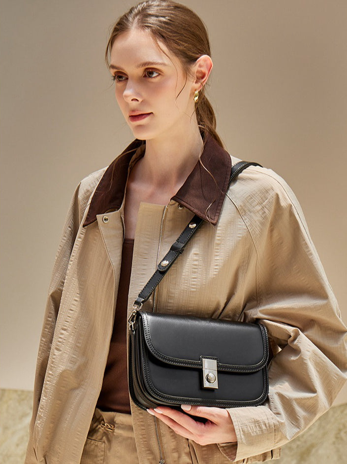 Women's Plain Cowhide Curved Satchel with Twist-Lock Closure